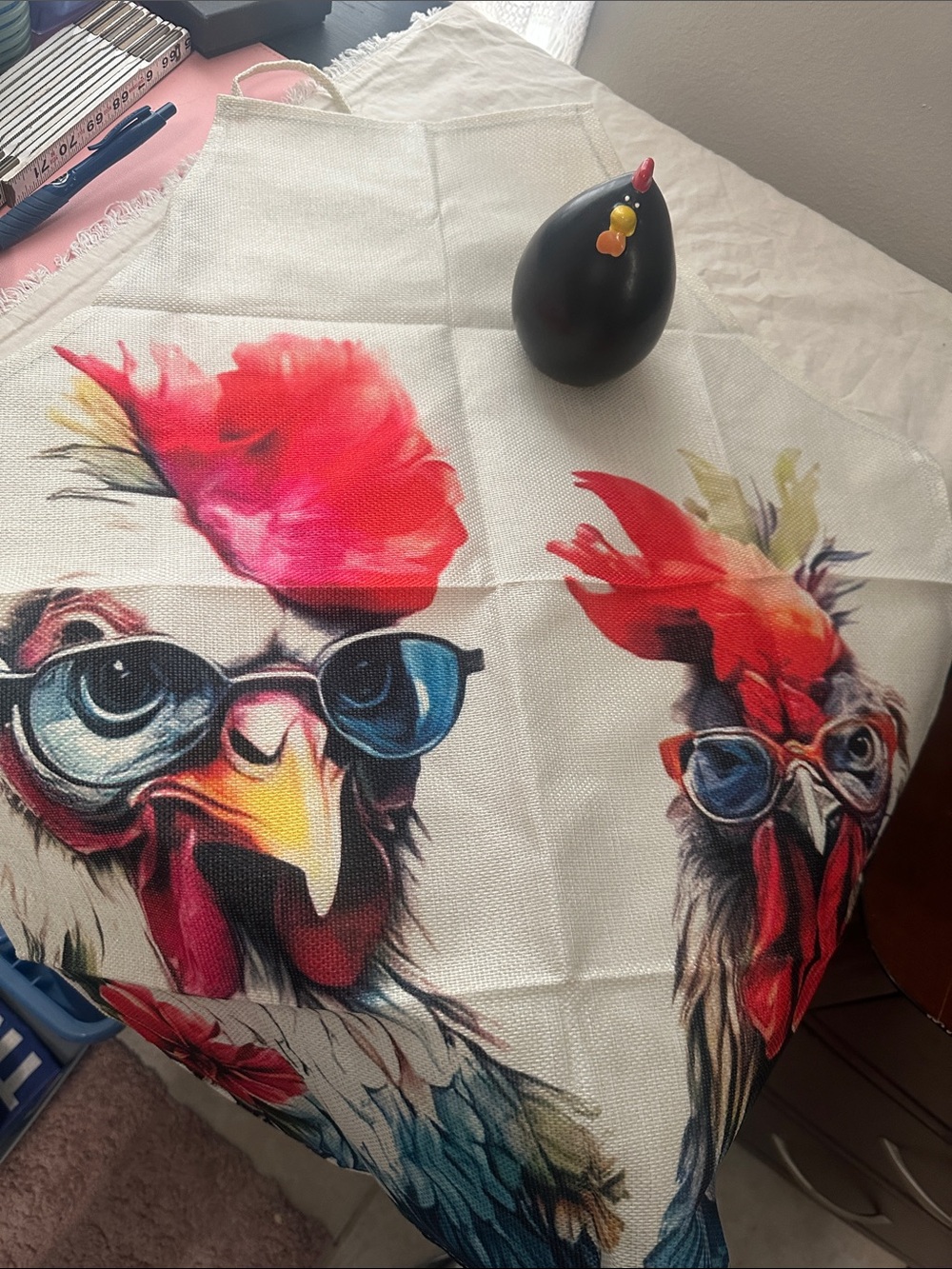 Colorful Rooster Apron with Sunglasses Print and a ceramic rooster. NWT